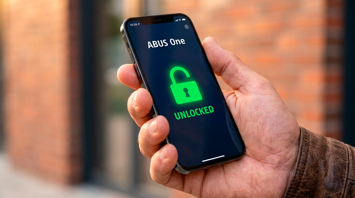 A smartphone screen displaying the ABUS One app with an unlocked status