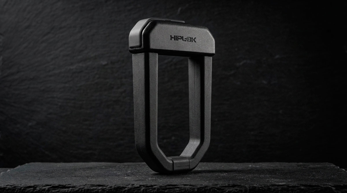 Matte black Hiplok D1000 anti-angle grinder U-lock securing the rear wheel of a Tern GSD cargo bike