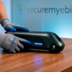 SafeRide Steve checking e-bike battery charge level for winter storage