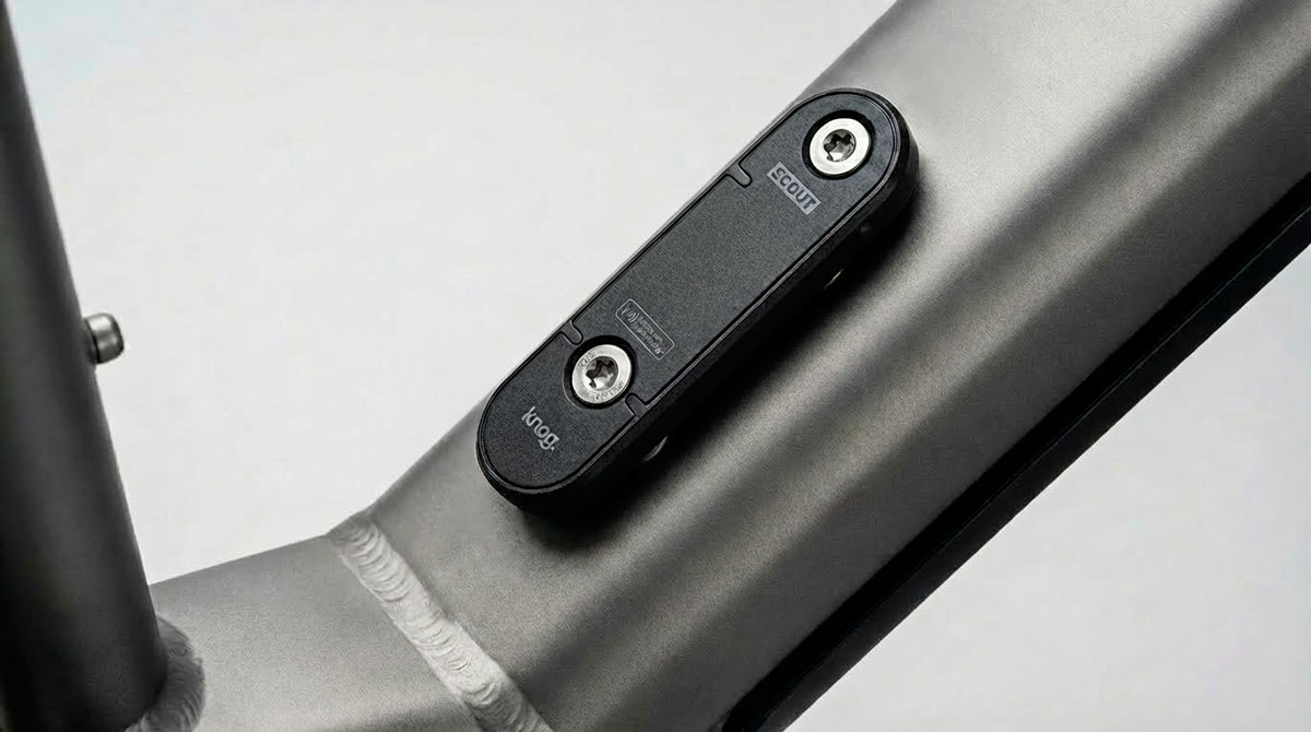 Knog Scout smart bike alarm and finder mounted on e-bike water bottle cage bosses