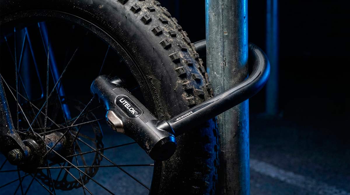 Litelok X3 lock securing a fat tire e-bike to a steel pole
